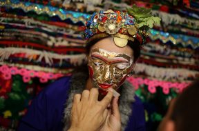 Bulgarian Muslim bride Lilova gets a special make-up called “ghelina” in front of the dowry during her wedding ceremony in the village of Draginovo